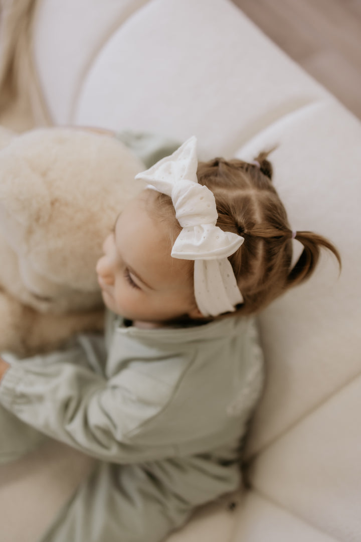 Eyelet bow headband to tie