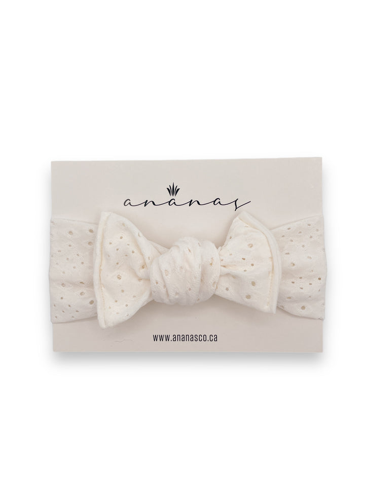 Eyelet bow headband to tie