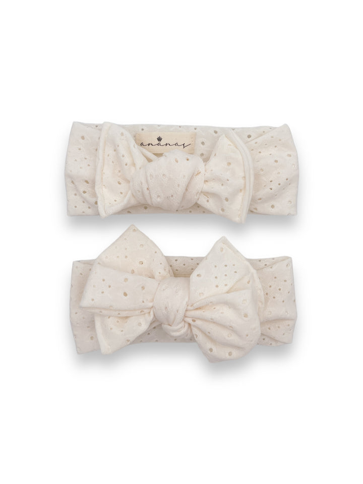 Eyelet bow headband to tie